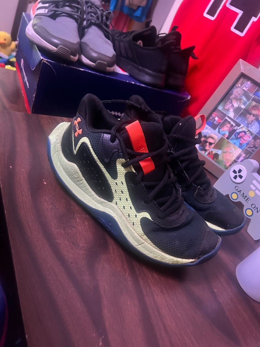 Under Armour Kids Black and Neon Green Athletic Sneakers with Orange Accent